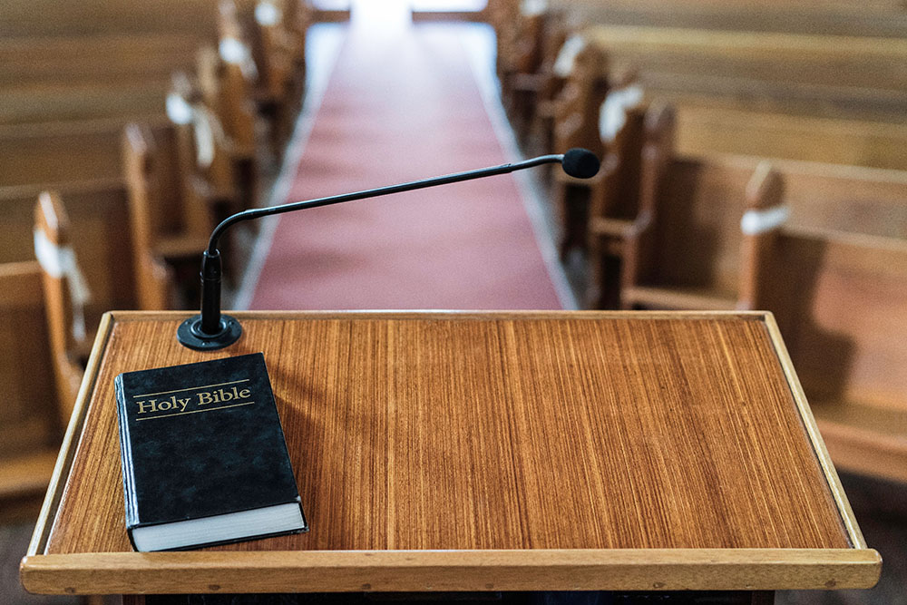 view-of-church-pulpit-with-bible-on-it-overlooking-22GCA88